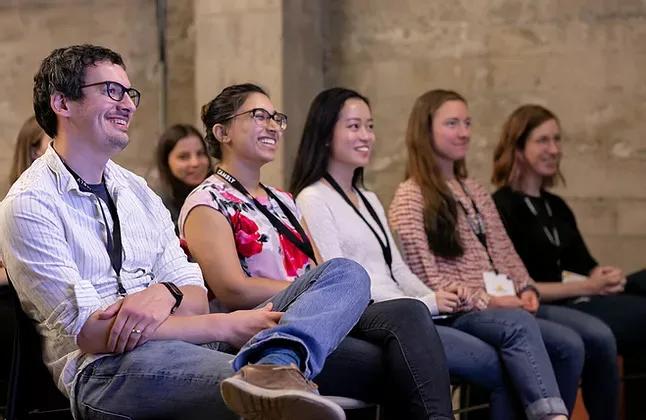 Cambly team members in the audience at a company all-hands