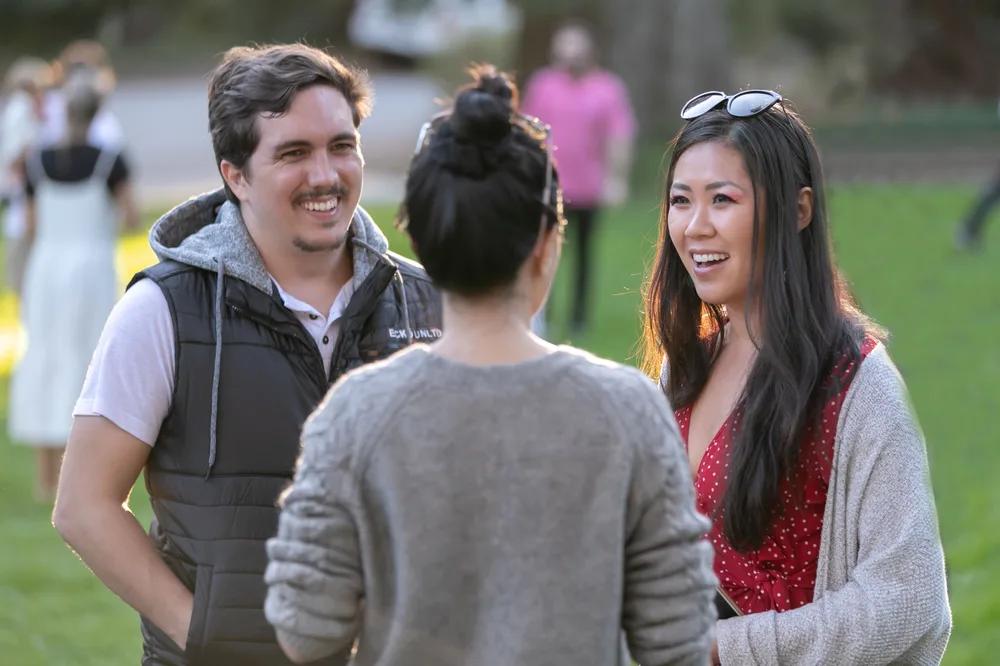 Cambly team members talking together outdoors